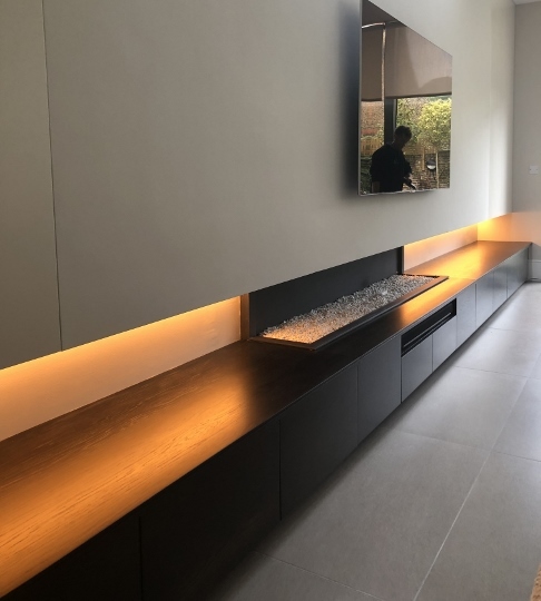 7m Long Base Unit With Tv Mounted In Wall And Integrated Fire