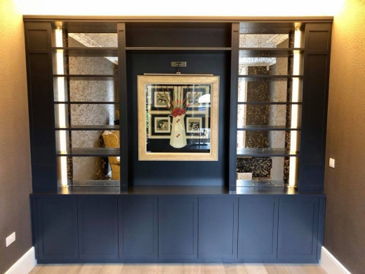 Large Painted Bookcase On Cupboards With Mirrors And Lighting