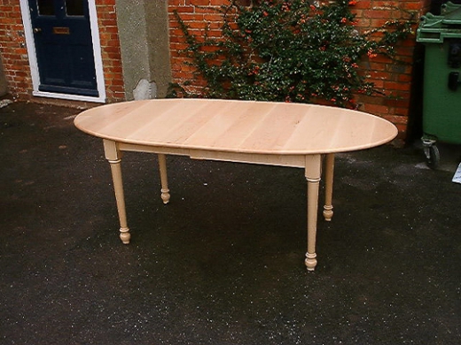 Maple extending oval table
